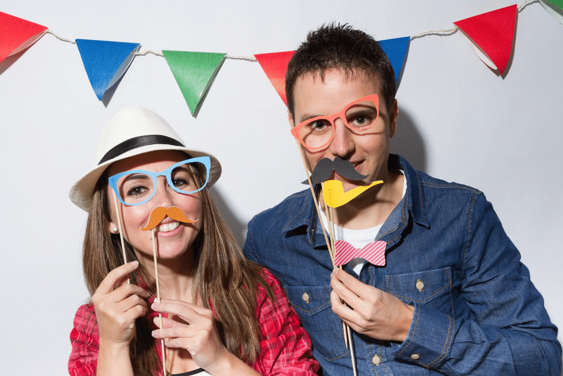 couple taking a picture in a photo booth at a birthday party in Thousand Oaks, CA