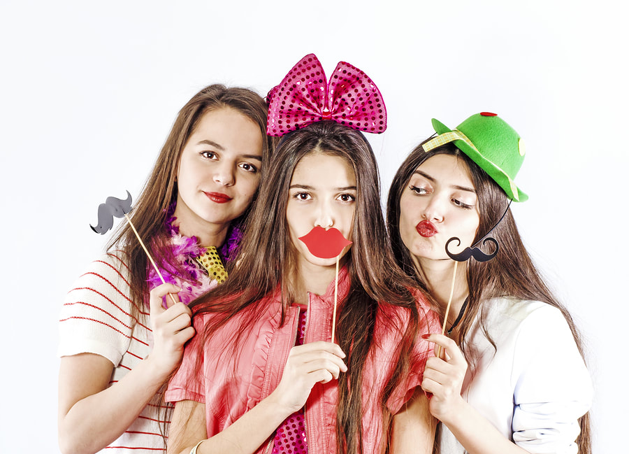 three girls having fun in a video booth in Calabasas, CA